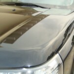 Before and after photographs of a damaged, black, Range Rover that was repaired by Elite Paint & Body Shop in West Palm Beach, FL.